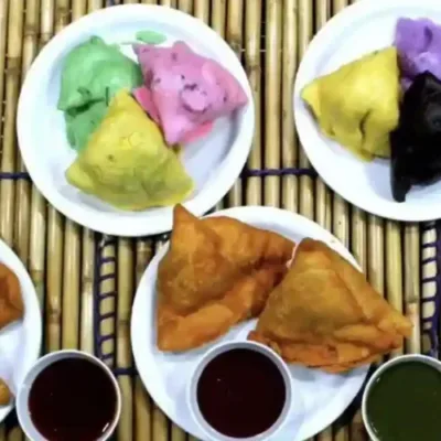 A 'blueberry samosa' on a plate, showcasing the sweet twist to the classic triangular pastry.