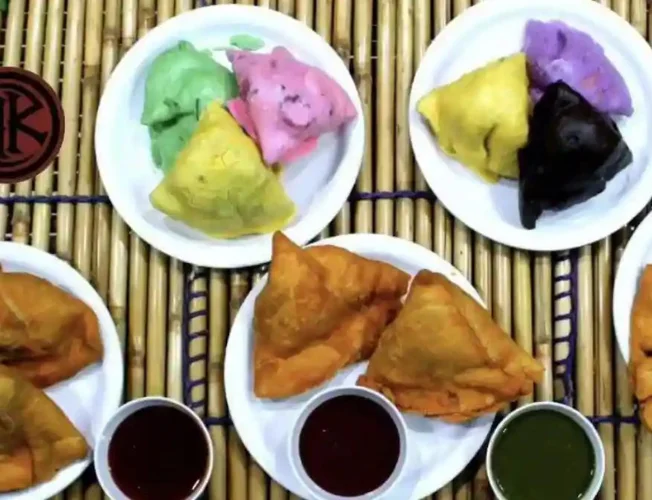 A 'blueberry samosa' on a plate, showcasing the sweet twist to the classic triangular pastry.