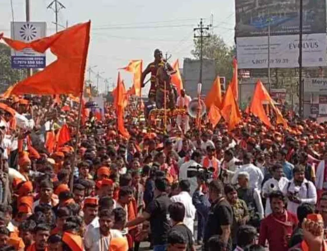 Aerial view of a large crowd participating in the Maratha quota protest march in Mumbai.