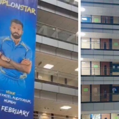 A group of students gathered around a blank space on a wall where a poster used to be, with the caption "Hardik Pandya's poster removed by Rohit Sharma fans.