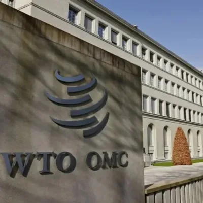 Gavel on cracked trade agreements, representing WTO dispute settlement dysfunction.