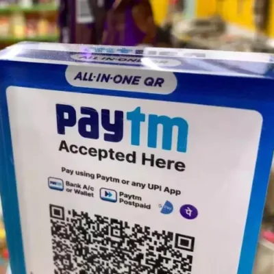 Split image: Paytm, Axis Bank, partnership.