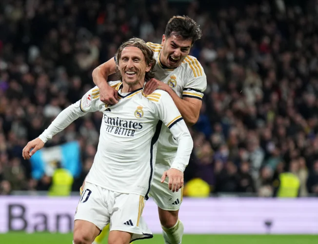 Luka Modric celebrates his winning goal in the Real Madrid vs. Sevilla match.