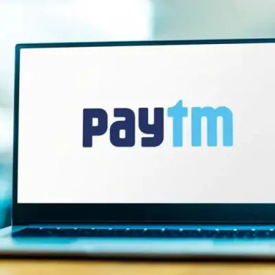 Gavel on document with logos of Paytm, ED, and RBI.