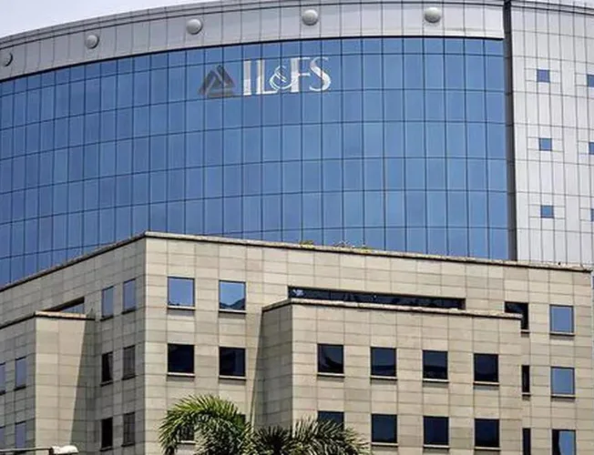 Gavel striking down on "Wilful Defaulter" with IL&FS logo.