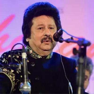 Close-up portrait of Pankaj Udhas singing.