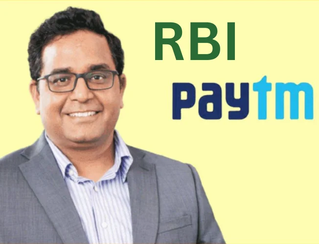 Illustration depicting the RBI logo and a magnifying glass, symbolizing regulatory scrutiny on Paytm.