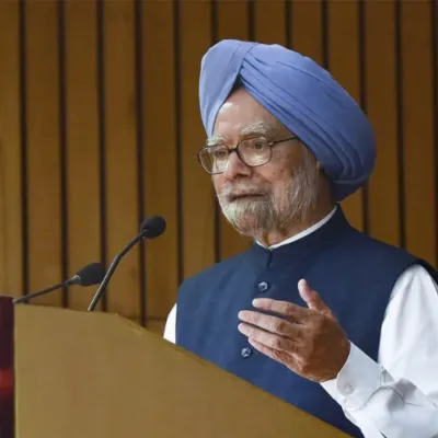 Prime Minister Narendra Modi delivering a speech in the Rajya Sabha, surrounded by seated members of parliament.