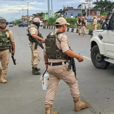 Manipur police personnel patrolling the streets.