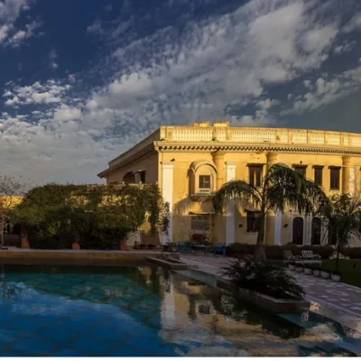 A stunning view of Royal Heritage Haveli's courtyard, adorned with colorful Rajasthani decor and lush greenery.