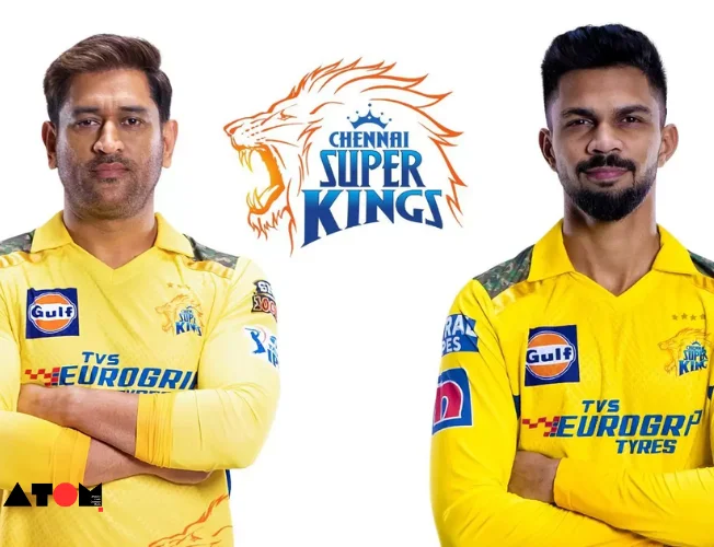 Ruturaj Gaikwad holding the CSK team jersey, with the team logo in the background.