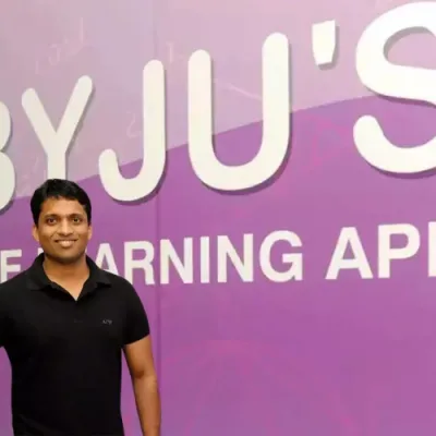 A magnifying glass examining a puzzle with missing pieces, representing the unclear situation surrounding BYJU's $533 million fund.