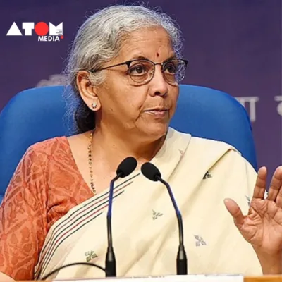 Nirmala Sitharaman, clad in a professional attire, stands confidently at a podium, addressing a gathered audience at the Times Now Summit 2024.