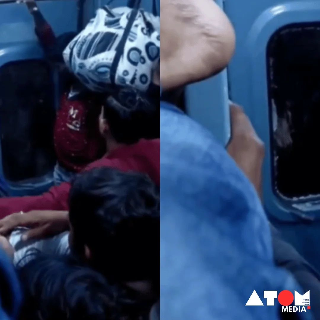 Image showing a passenger taking aggressive action by breaking the glass of a train door due to obstruction from ticketless passengers.