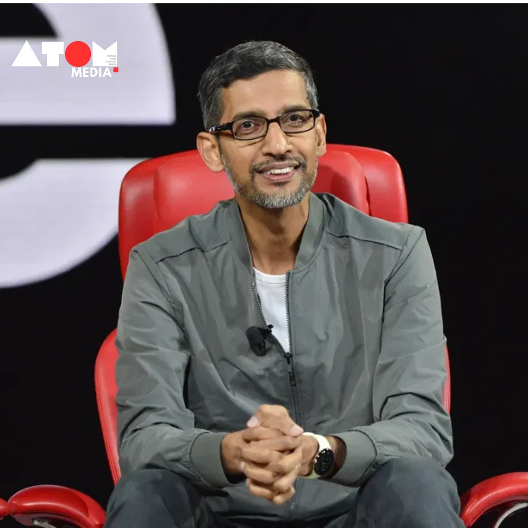 The image shows Sundar Pichai, CEO of Google, standing in front of a microphone and addressing a group of Google employees. He appears engaged and determined.