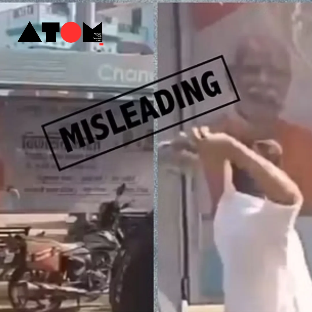 The image depicts a scene from the viral video where a man is seen hurling stones at a poster of Prime Minister Narendra Modi. This image is circulated online in the context of political discussions.