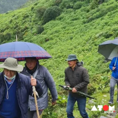 The image captures the dedication of polling officials in Arunachal Pradesh as they traverse through mountains and rivers to conduct repolling in 8 booths, showcasing their commitment to ensuring a fair democratic process despite challenges.