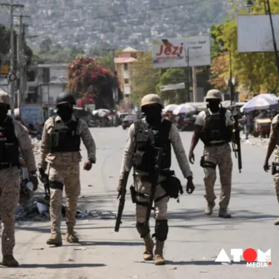 The image captures the solemn moment as members of Haiti's Transitional Ruling Council assemble for the inauguration ceremony. Against a backdrop of political turmoil and violence, the council symbolizes hope for stability and governance in the nation.