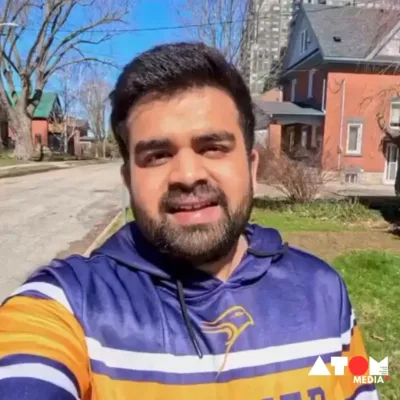 The image shows Mehul Prajapati, an Indian-origin student, facing online backlash after posting a video of his visit to a Canadian food bank. He addresses the controversy and seeks to clarify misunderstandings.