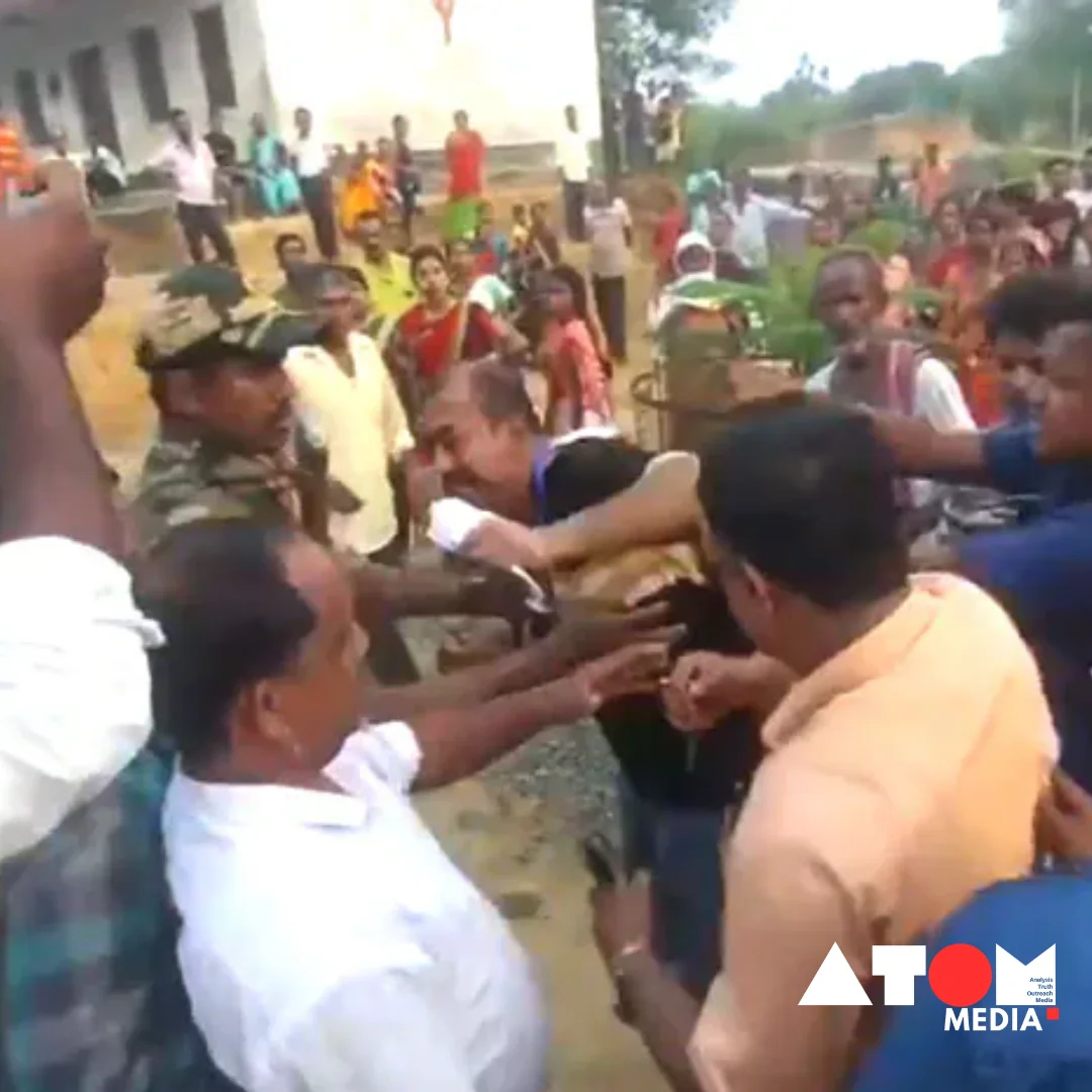 In the image, a BJP leader is seen slapping a polling official at a polling station in Tripura.