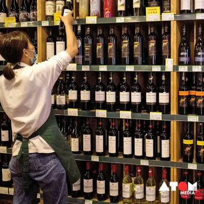 Illustration depicting wine bottles and glasses representing China's wine market challenges and opportunities.