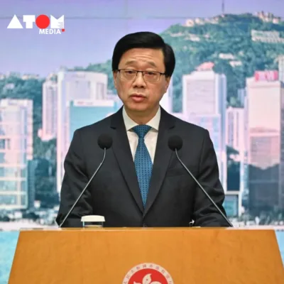 The image illustrates the significance of proposed tax reforms in enhancing Hong Kong's competitiveness in the global finance sector, symbolized by a city skyline adorned with financial buildings and currency symbols.