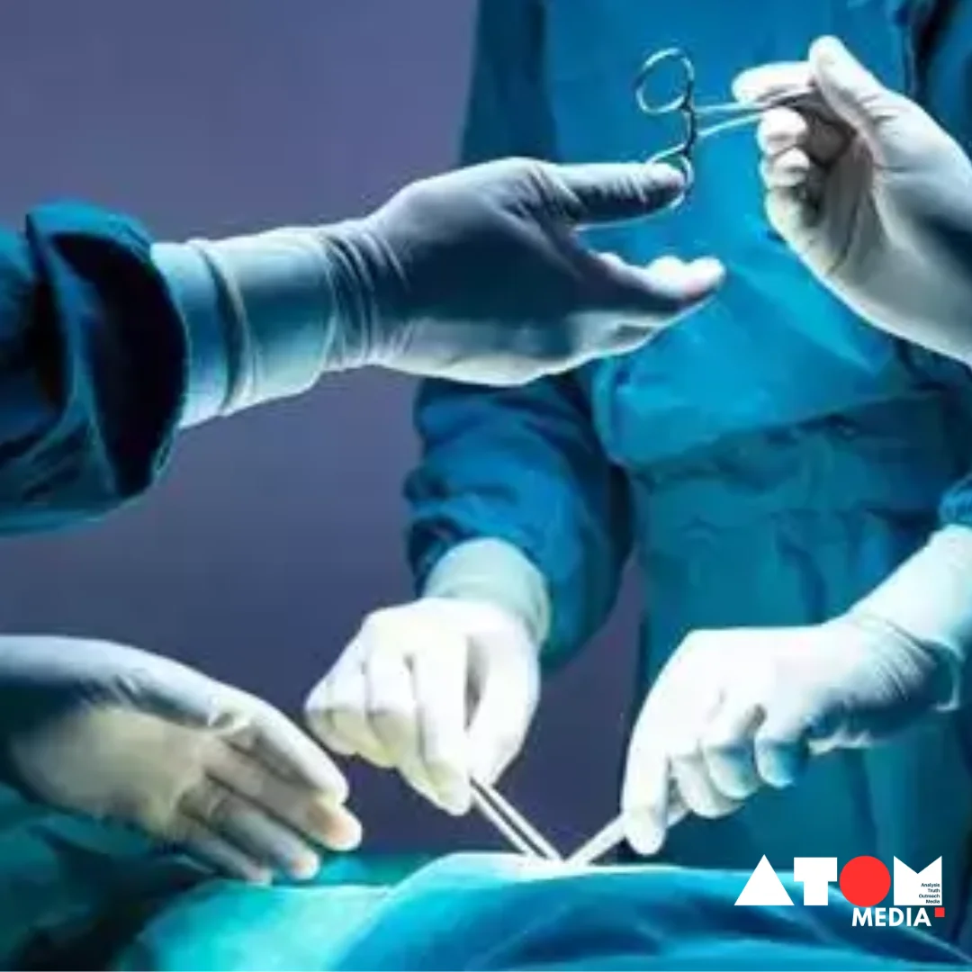 Image showing a doctor performing a surgical procedure in a hospital.