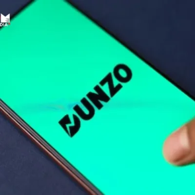 Dunzo logo with a pause button symbolizing the company getting a temporary reprieve.