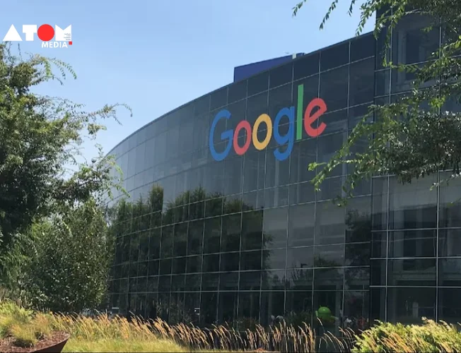 A modern office building with the Google logo displayed prominently. In the background, a map of India highlights Bengaluru.