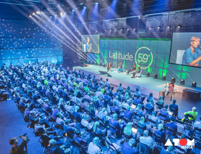The image depicts Indian entrepreneurs networking and exchanging ideas at Latitude59, Estonia's premier tech event, showcasing collaboration opportunities in the global startup ecosystem.