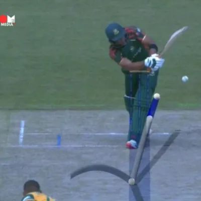 : Bangladesh and South Africa teams in action during the controversial T20 World Cup 2024 match, where a DRS decision denied Bangladesh crucial runs.