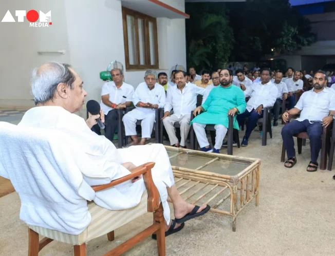 BJD leaders discussing strategy in a political meeting.