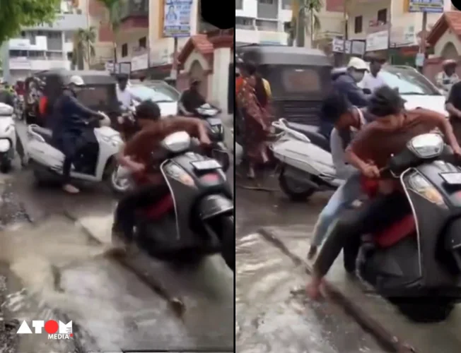 Image showing waterlogged potholes on a street in Pune's Dighi area, causing difficulties for commuters.