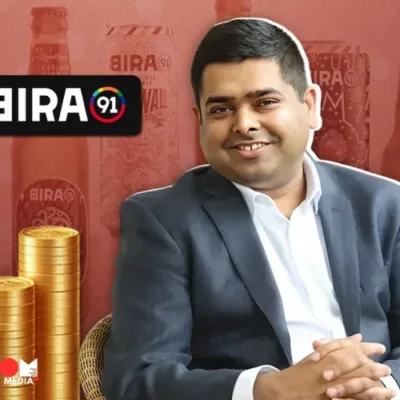 Bira 91 craft beer bottles displayed on a bar counter.