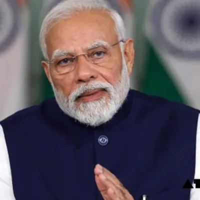 Prime Minister Narendra Modi addressing a business summit, highlighting economic reforms.