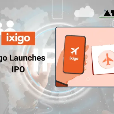 A mobile phone displaying the ixigo app on its screen, showcasing travel booking options for flights, trains, buses, and hotels.