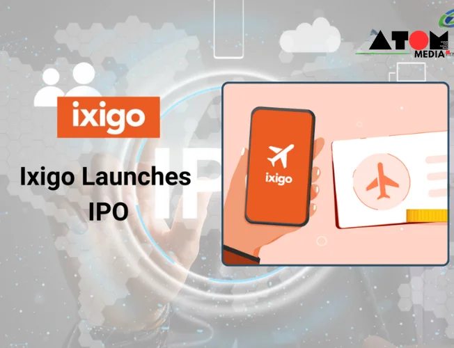 A mobile phone displaying the ixigo app on its screen, showcasing travel booking options for flights, trains, buses, and hotels.